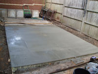 Newly laid concrete shed base